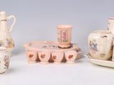 many different types of porcelain items on the table