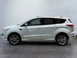 the white ford kuga is parked in a large room