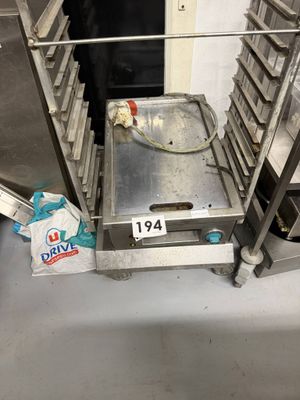 an image of a conveyor belt with a tray of doughnuts