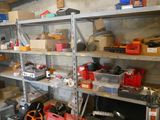 lots of tools on the shelves in the garage
