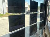 a picture of a window that has a bunch of tvs on it