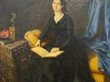 tableau représentant une femme en robe noire assise sur un canapé jaune