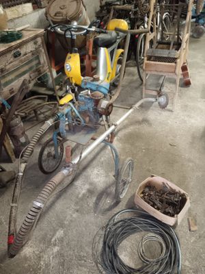 a small child ' s bike that is parked in a garage