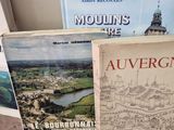 three books are sitting on a table next to each other