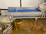 a picture of a conveyor belt in a factory