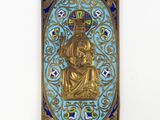 a close up of a gold statue on a blue background