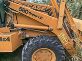 a tractor that is parked on the side of the road