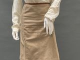 an image of a mannequin wearing a tan skirt and a white blouse