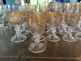 a lot of wine glasses sitting on a table