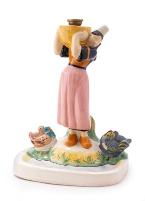 a figurine of a woman with a basket on her head