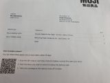 a close up of a piece of paper with a qr code on it