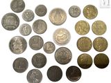 a lot of coins that are on a white surface