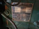 a sign on the side of a green machine