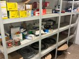 many shelves with various items on them in a room