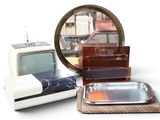 a lot of items that include a tv, a mirror, and a tray