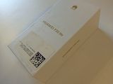 a white box with a qr code on it sitting on a table