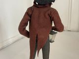 a figurine of a man with a hat and a top hat