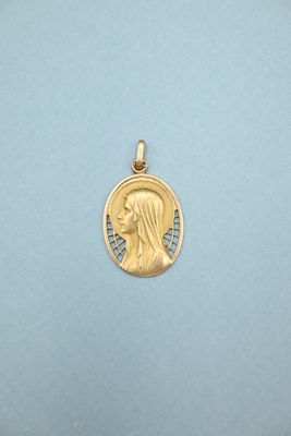 a close up of a gold medal on a blue surface