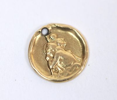a gold coin with a picture of a man riding a horse