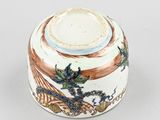 an image of a white and brown bowl with flowers and birds on it
