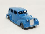 a blue toy car that is sitting on a white surface