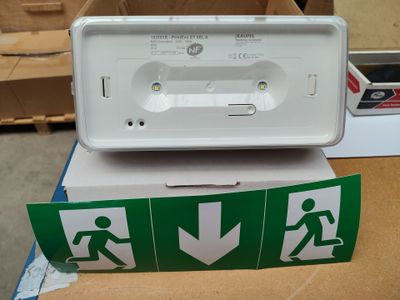 a white box with a green and white sign and a white box with a green and white sign and a white box with a green and white sign