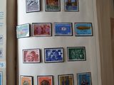 an open book with stamps on it on a table