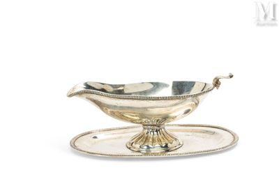 an antique silver plate with a bowl on it on a tray