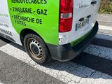 a van that is parked on the side of the road
