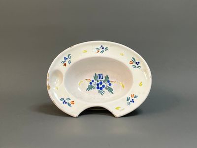 an image of a small bowl with a flower design on it
