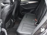 the back seats of a car with a bottle in the passenger seat