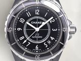 a close up of a watch on a white surface