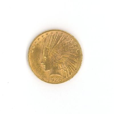 l'image d'un gros plan d'une pièce d'or sur une surface blanche