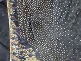 a close up of a black and white polka dot scarf