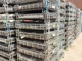 a large pile of metal cages stacked on top of each other