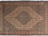 un ancien tapis persan à motif de médaillon