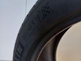 a close up of a tire on a white surface