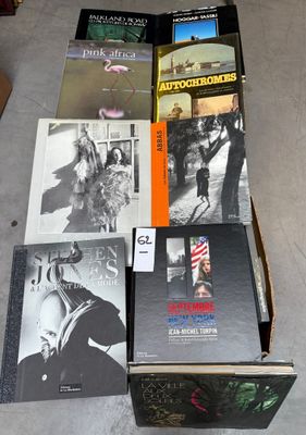 several books are stacked on top of each other on a table