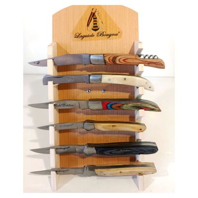 many knives that are hanging on a wooden rack