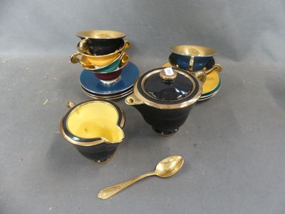 three cups and a spoon sitting on a table