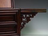 a close up of a wooden shelf with a shelf on it