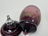 two vases that are sitting on a table