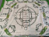 a green and white table cloth with a picture on it