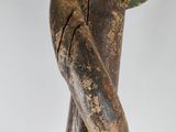statue of a woman holding a flower in her hand