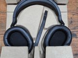 the headphones are in a cardboard box on a wooden table