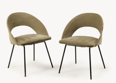 pair of mid century style chairs with black legs and a beige upholstered seat