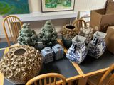 many vases sitting on a table in a room