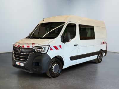 a white van with red stripes parked in a room