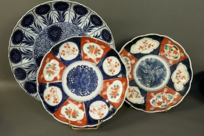 two plates with designs on them are sitting on a table