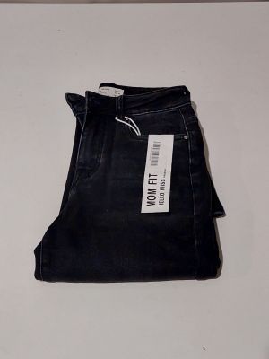 the jeans are black and have a white tag on them